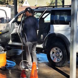 Modesto Hand Car Wash & Detail - The guy is using a POWER WASHER to clean the inside of my SUV.