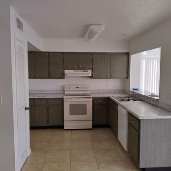CHAMPION Home Improvement LLC - kitchen with tile floor - Handyman Near Me CHAMPION Home Improvement LLC - kitchen with tile floor - Handyman Near Me