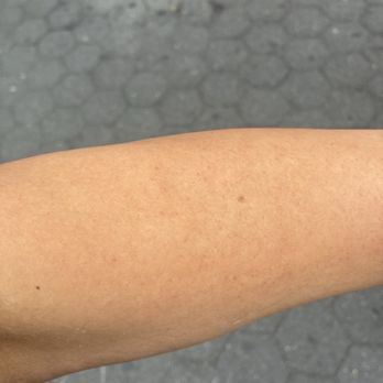 Sugaring NYC - Union Square - Freshly waxed arm SUPER SMOOTH - Eyelash Service Near Me - New York, New York