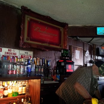 Cherry Pit - a man standing at a bar - Bars Near Me - Orange, California
