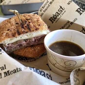 Roast Sandwich House - Roast Beef Melt- Caramelized onions, Swiss, horseradish sauce & garlic butter on everything Ciabatta with a side of au jus - Sandwiches Near Me - Melville, New York