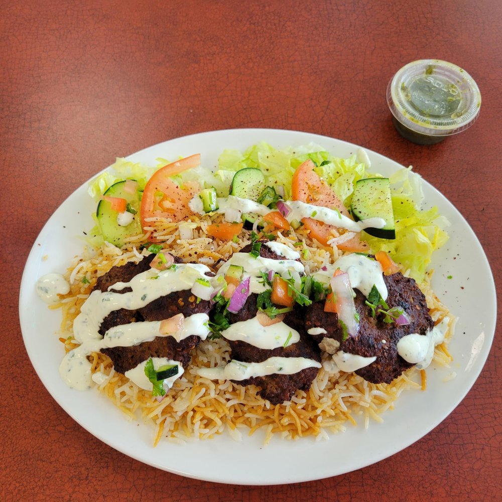 Chapli patties over rice. Chapli patties over rice.