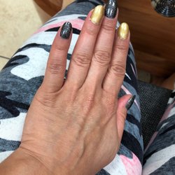 Classic Nail - Gel mani...very mediocre.  Gel polish left in my skin like it's no big deal!  SMH!  1st visit & last visit!