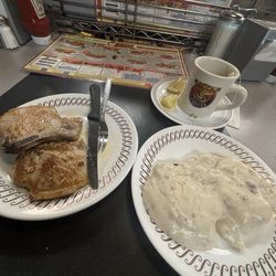 Waffle House - Biscuits &  Gravy with a side of pork chops.
