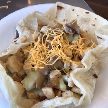 El Güero Canelo Restaurant - Adding cheese, mushrooms and salsa to a chicken burro - Mexican Near Me - Tucson, Arizona El Güero Canelo Restaurant - Adding cheese, mushrooms and salsa to a chicken burro - Mexican Near Me - Tucson, Arizona