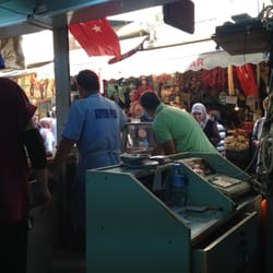 Meşhur Kuyum Pide Salonu - A view from the inside out to the pedestrian walkways in the bazaar. Tables are both at street level and upstairs.