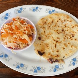 Bean and pork Papusa with a crisp slaw.