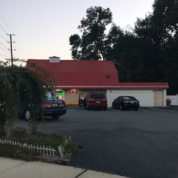 Dairy Deluxe - Private parking lot with picnic tables in their patio area out back - Ice Cream & Frozen Yogurt Near Me - Highland Park, New Jersey
