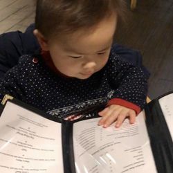 Maru Izakaya - My son perusing the menu at Maru.