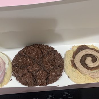 Crumbl - New Braunfels - L to R: lemon blackberry, chocolate sprinkle, maple cinnamon roll, milk chocolate chip. - Bakeries Near Me - New Braunfels, Texas Crumbl - New Braunfels - L to R: lemon blackberry, chocolate sprinkle, maple cinnamon roll, milk chocolate chip. - Bakeries Near Me - New Braunfels, Texas