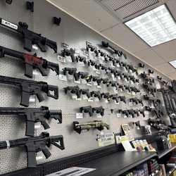 Caliber Arms and Ammo - Rotating inventory portion of gun wall