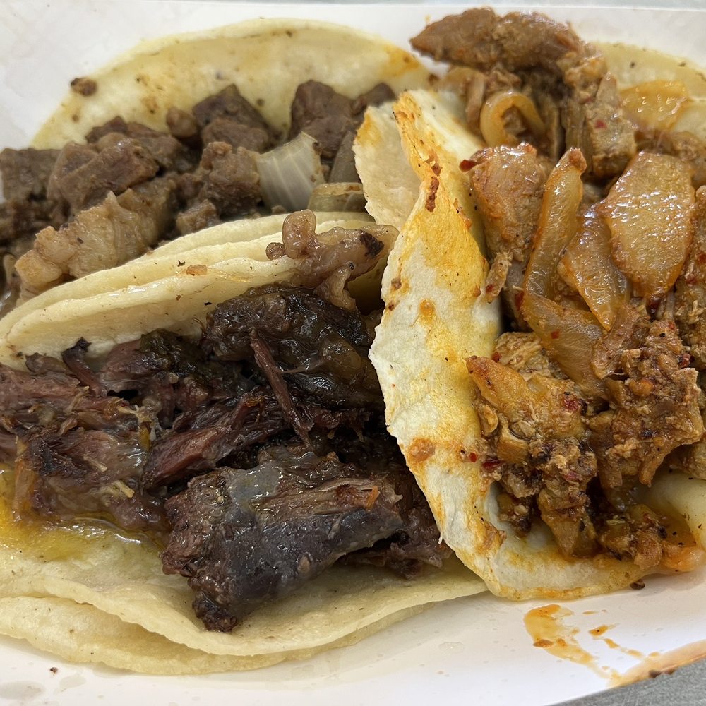 Al pastor, carne asada, and barbacoa tacos