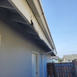 Before, this was the SW side of the home where the wind-driven rain pounded the wood all winter. Notice the 10' sections of gutter.