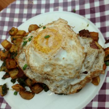Cask & Larder - Butcher’s Hash with brisket and crispy potatoes, topped with a perfectly cooked over hard fried egg. - Southern Near Me - Orlando, Florida