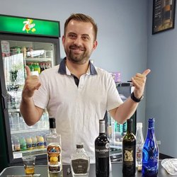 Mike's Wine & Spirits - Sly pouring out some Wines & Vodka !