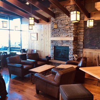Caribou Coffee - a living room with a fireplace - Coffee & Tea Near Me - Lakeville, Minnesota
