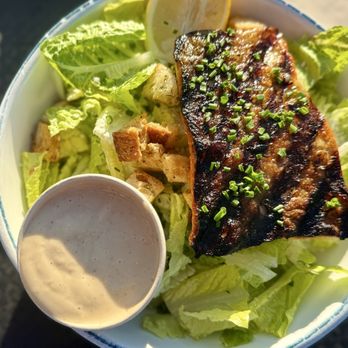 Fish - Rainbow trout over Caesar salad - Seafood Near Me - Sausalito, California Fish - Rainbow trout over Caesar salad - Seafood Near Me - Sausalito, California