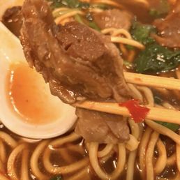 Beef pieces in soup.