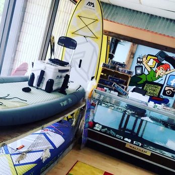 Never Ever Boards - Beast, Drift, and Vibrant paddle boards on display. Forever young! - Skate Shops Near Me - Oak Island, North Carolina