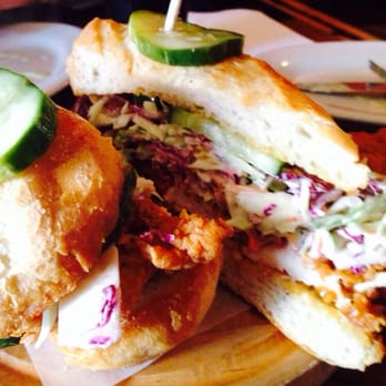 The Eagle OTR - Fried chicken sandwich with cole slaw and spicy mayo on warm baguette - American Near Me - Cincinnati, Ohio The Eagle OTR - Fried chicken sandwich with cole slaw and spicy mayo on warm baguette - American Near Me - Cincinnati, Ohio