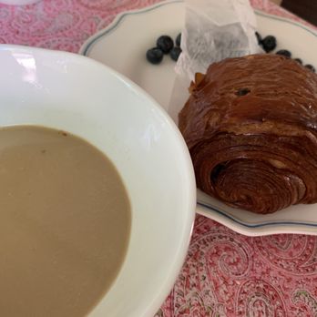 Nirvana Coffee Company - Chocolate croissant with pistachio latte which tastes more like coffee with milk. - Coffee & Tea Near Me - Barnstable Village, Massachusetts