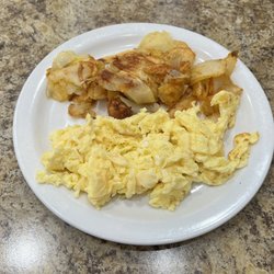 Bob's Coffee Shop - Part of the bone in ham breakfast scrambled eggs and country potatoes