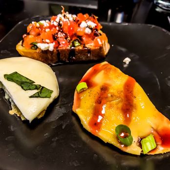 Kingston's Steakhouse - Appetizers: Duck Wonton with raspberry drizzle, fried green tomatoes, bruschetta. - Steakhouses Near Me - Cedar Rapids, Iowa Kingston's Steakhouse - Appetizers: Duck Wonton with raspberry drizzle, fried green tomatoes, bruschetta. - Steakhouses Near Me - Cedar Rapids, Iowa
