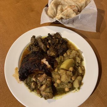 Pam's Caribbean Kitchen - Curry Chicken and curry lamb with potatoes and chick peas aka Chana and roti on the side. - Trinidadian Near Me - Seattle, Washington Pam's Caribbean Kitchen - Curry Chicken and curry lamb with potatoes and chick peas aka Chana and roti on the side. - Trinidadian Near Me - Seattle, Washington