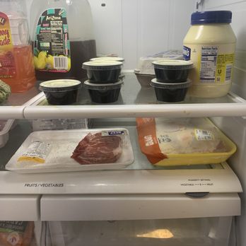 Wingstop - the inside of a refrigerator full of food - Chicken Wings Near Me - Gaithersburg, Maryland