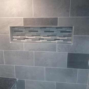 Sanford Built - a tiled shower with a bench - General Contractors Near Me - Warsaw , Missouri Sanford Built - a tiled shower with a bench - General Contractors Near Me - Warsaw , Missouri