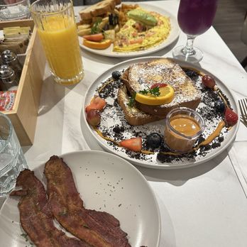Taste & Glory - Thai Tea French Toast, California Omelette, Side Order of Bacon, Blue Butterfly Drink, and Orange Juice. - Breakfast & Brunch Near Me - San Mateo, California Taste & Glory - Thai Tea French Toast, California Omelette, Side Order of Bacon, Blue Butterfly Drink, and Orange Juice. - Breakfast & Brunch Near Me - San Mateo, California