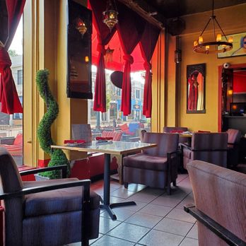 Ranoush - the interior of a restaurant with red curtains - Middle Eastern Near Me - Saint Louis, Missouri Ranoush - the interior of a restaurant with red curtains - Middle Eastern Near Me - Saint Louis, Missouri