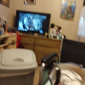 Lucky Star - a living room with a television and a trash can - Chinese Near Me - Marianna, Arkansas