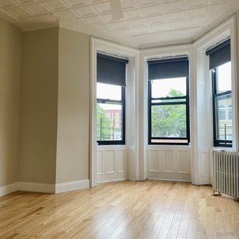 LEY Home Improvements - empty living room with wood floors - General Contractors Near Me - Queens, New York
