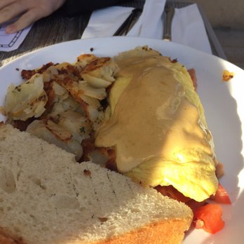 Cafe M - Omelet had a spread of hollondaise on top and tasty stuffings - Breakfast & Brunch Near Me - Berkeley, California