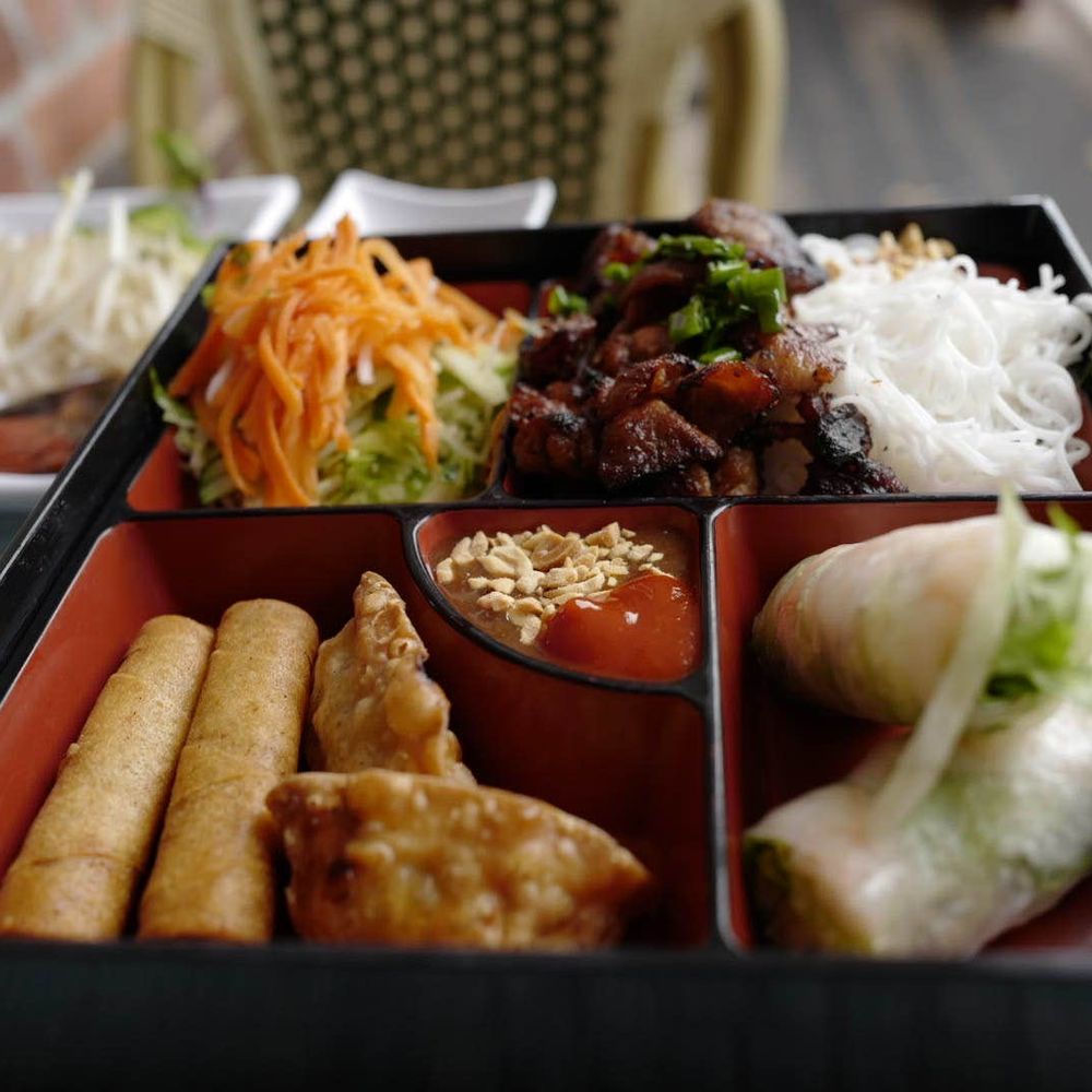 Saigon Cafe Millburn - Amazing offering bento box filled with all the best: spring roll, egg roll, vermicelli salad with crispy pork. - Vietnamese Near Me - Millburn, New Jersey Saigon Cafe Millburn - Amazing offering bento box filled with all the best: spring roll, egg roll, vermicelli salad with crispy pork. - Vietnamese Near Me - Millburn, New Jersey