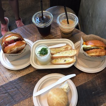 Eggslut - Bacon Egg and Cheese (left), Slut (center), Sausage Egg and Cheese (right), and Buttermilk Biscuit (bottom) - Breakfast & Brunch Near Me - Los Angeles, California