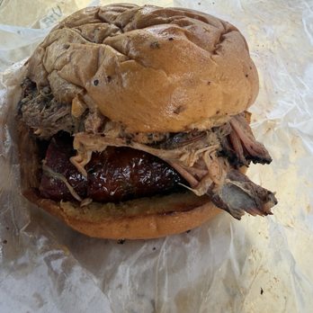 Lewis Barbecue - "EL SANCHO LOCO" pulled pork or chopped brisket and sausage piled high on a fresh bun w pickled red onions - Barbeque Near Me - Charleston, South Carolina Lewis Barbecue - "EL SANCHO LOCO" pulled pork or chopped brisket and sausage piled high on a fresh bun w pickled red onions - Barbeque Near Me - Charleston, South Carolina