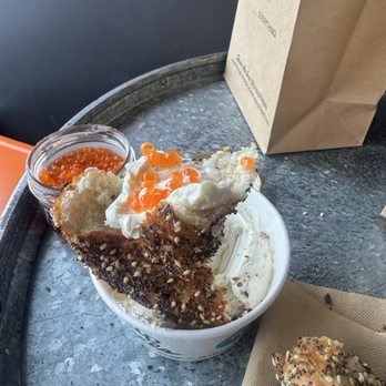 PopUp Bagels - Everything bagel with a Schmear or dip of cream cheese and trout  row - Bagels Near Me - Roslyn, New York