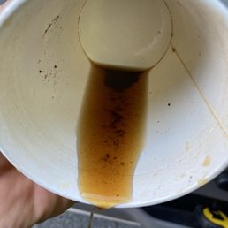 a person holding a cup of coffee a person holding a cup of coffee