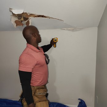 1-800 Water Damage - Scanning materials to find moisture after tree fell and punctured roof and ceiling materials - Damage Restoration Near Me - Cypress, Texas 1-800 Water Damage - Scanning materials to find moisture after tree fell and punctured roof and ceiling materials - Damage Restoration Near Me - Cypress, Texas