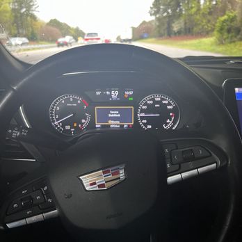 Budget Car Rental - Steering wheel turned to the left to keep the car going straight. - Car Rental Near Me - Morrisville, North Carolina