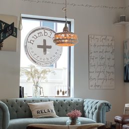 a living room with a couch and a coffee table a living room with a couch and a coffee table