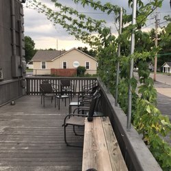 Blue Holler Brew Supplies - Nice patio with hops growing!
