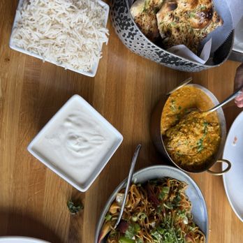 Bombay Street Kitchen - Hakka noodles, raita (yogurt), rice, naan. I forgot the other vegetarian dish name - Indian Near Me - Orlando, Florida