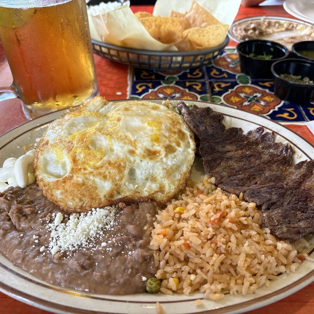 Super A's - Chilaquiles with carne asada and over hard eggs - Mexican Near Me - Costa Mesa, California Super A's - Chilaquiles with carne asada and over hard eggs - Mexican Near Me - Costa Mesa, California