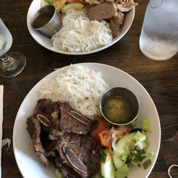 The Rolling Spring Roll - Back: spring roll & pork noodle bowl Front: short rib noodle bowl - Vietnamese Near Me - Syosset, New York The Rolling Spring Roll - Back: spring roll & pork noodle bowl Front: short rib noodle bowl - Vietnamese Near Me - Syosset, New York