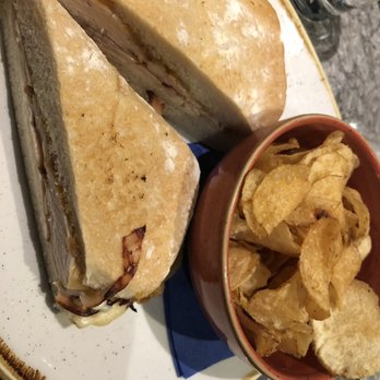 Currant Bistro - Turkey cheese glazed pear sandwich with a side of chips - New American Near Me - Seattle, Washington Currant Bistro - Turkey cheese glazed pear sandwich with a side of chips - New American Near Me - Seattle, Washington