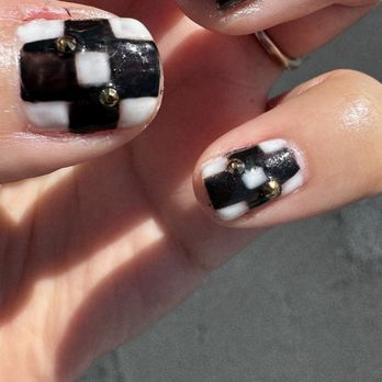Sunset Nail Spa - Also the technician did the black first and then the white. The other technician did the white first and then the black - Nail Salons Near Me - Henderson, Nevada