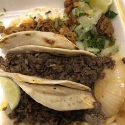 2 beef tacos/1 spicy pork
